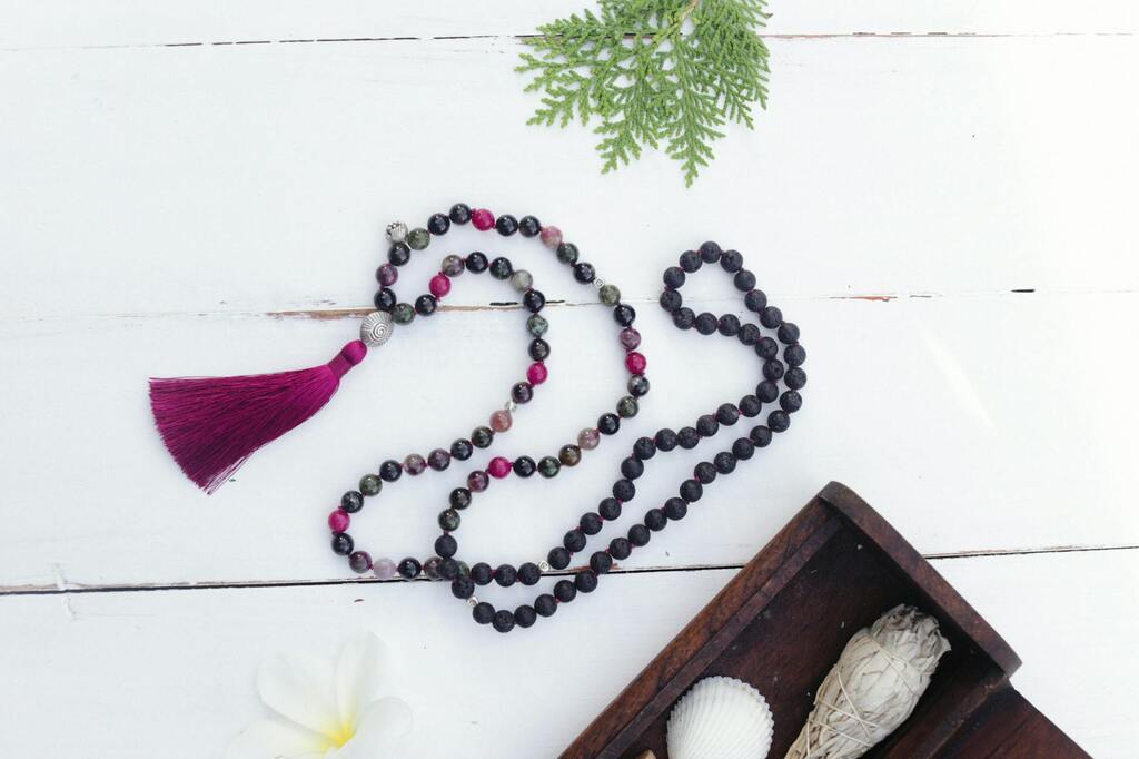 a close up shot of a mala bead necklace